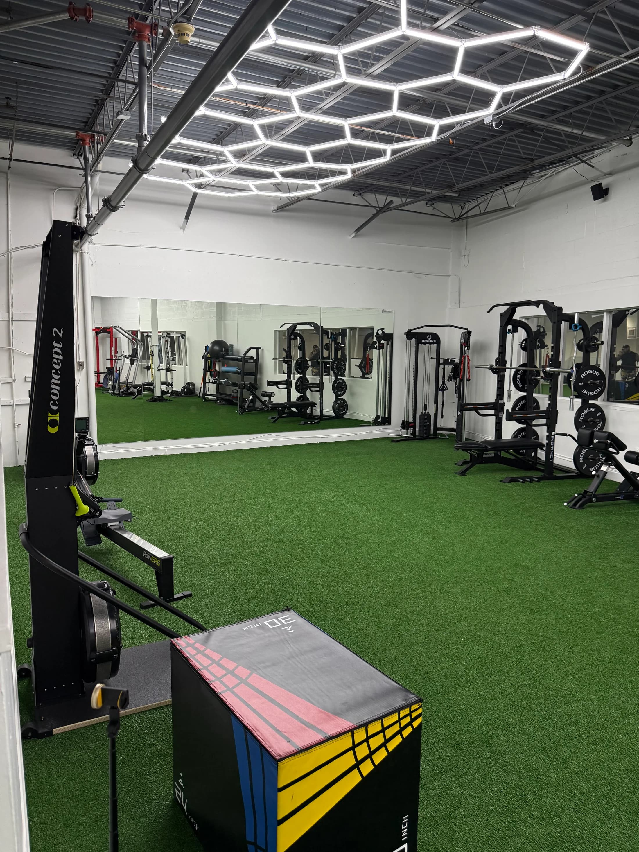 The open turf and equipment area inside The Lions Den Boca